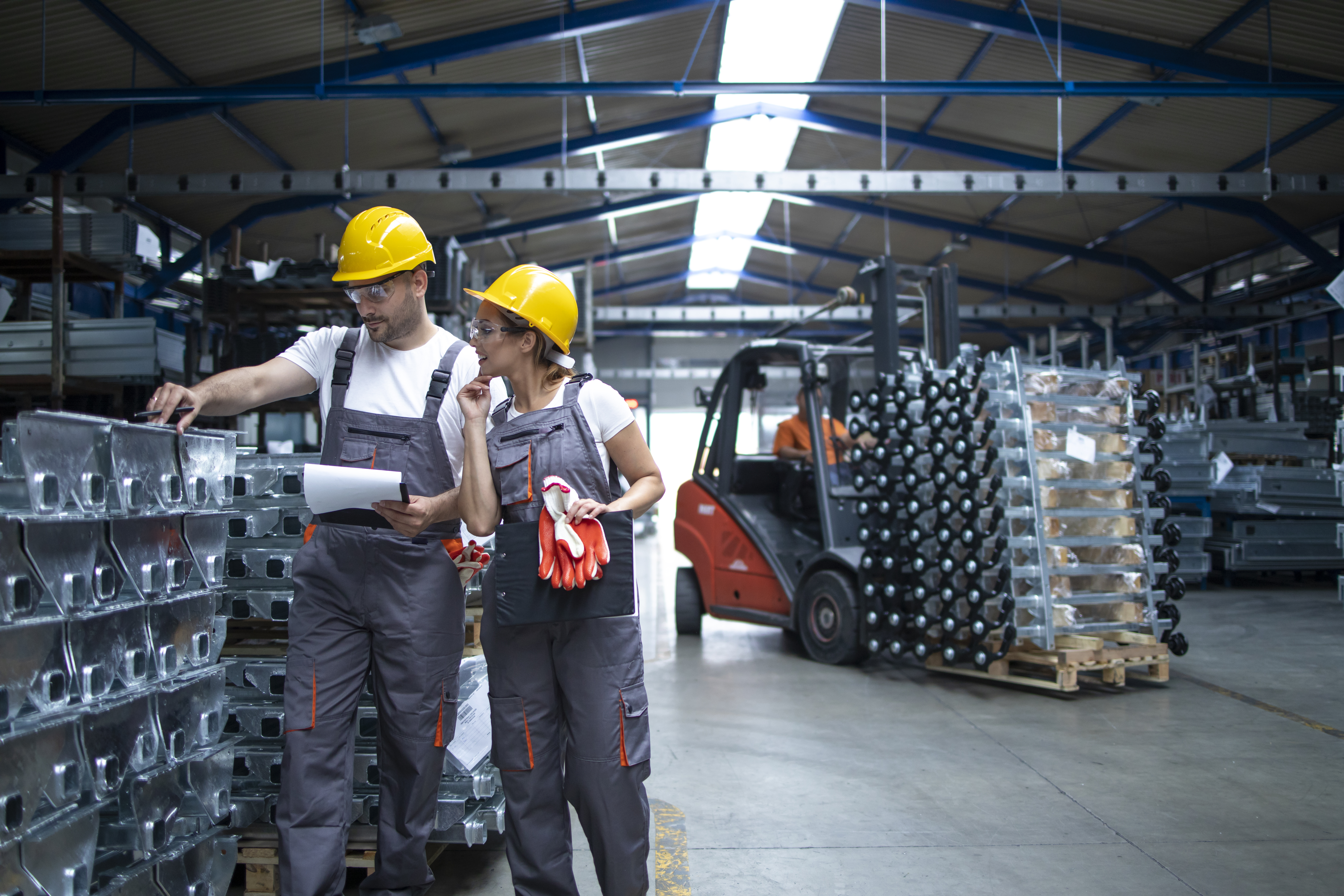 Logistics team coordinating materials inside a warehouse